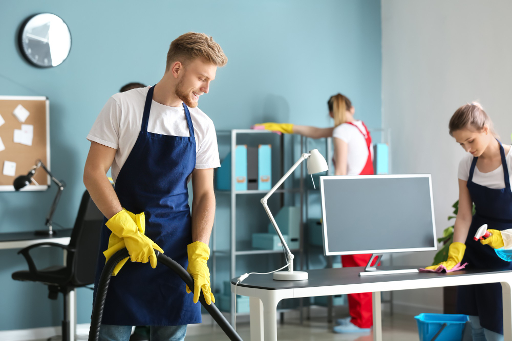 Group of cleaners tidying and cleaning a small office to represent SoftLayer to Azure migration case study